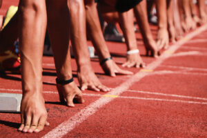 people at a starting line representing the race between facebook vs websites for business