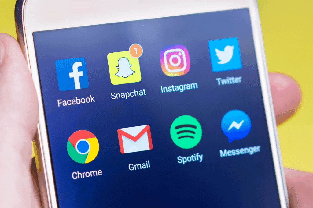 someone holding a phone wondering how much does social media marketing cost