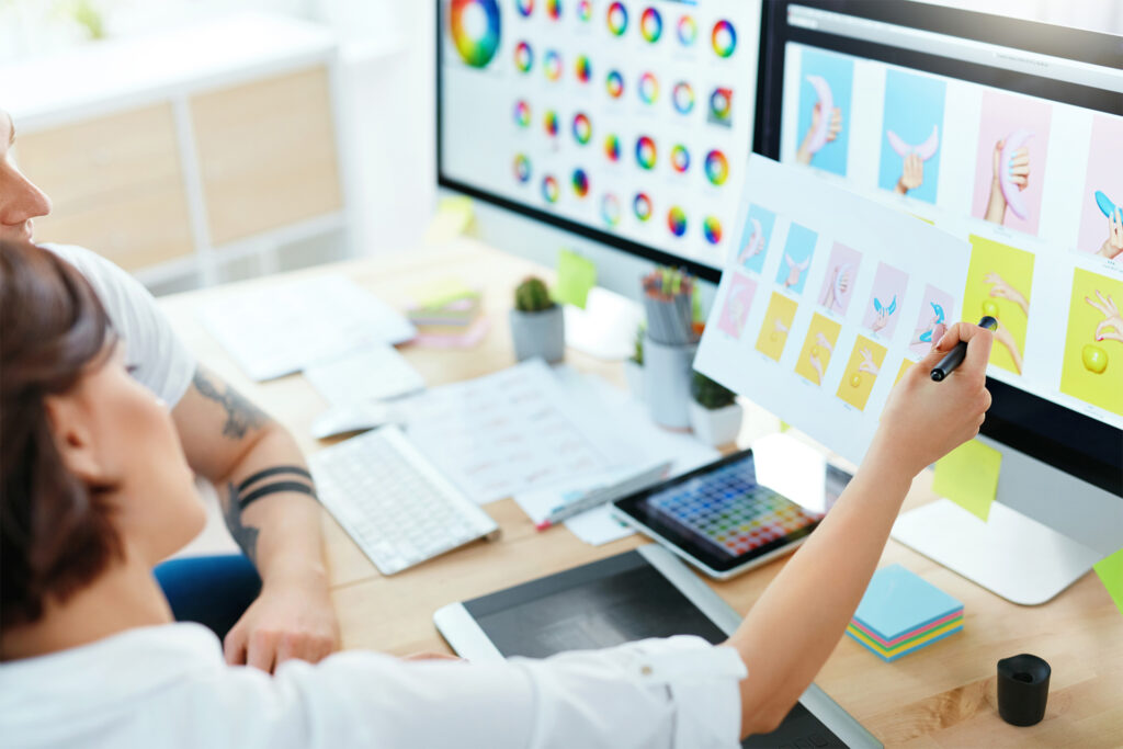 web designers looking at various grahics