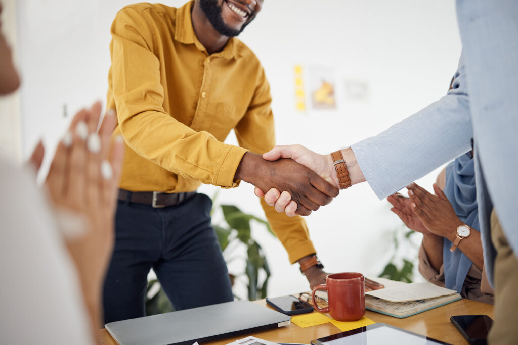 a b2b business shaking hands with a client about content strategy