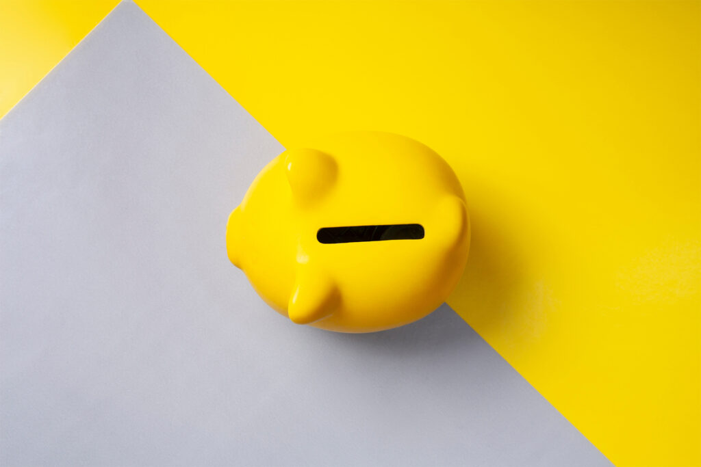 a representation of cost of google paid ads with a yellow piggybank