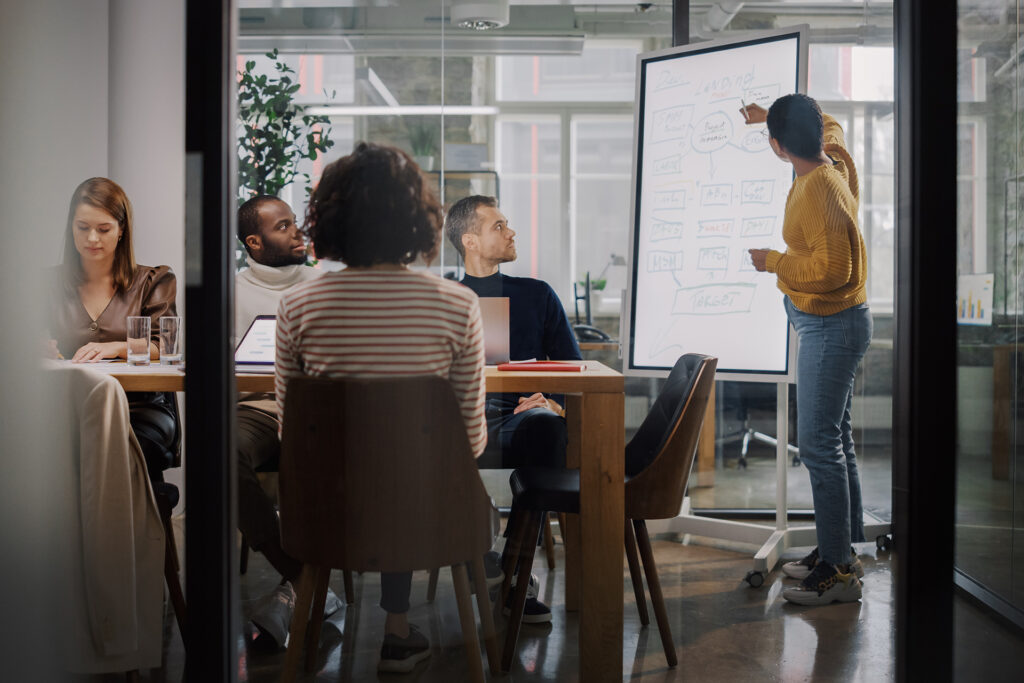 a marketing team strategising around improving their client's backlink profile