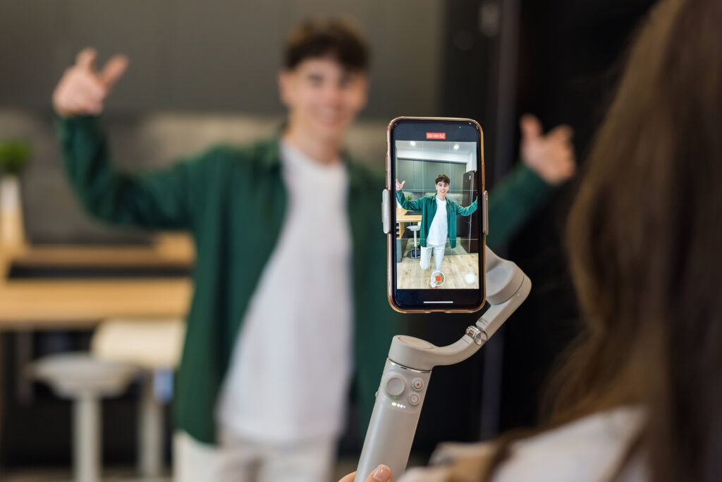 an influencer filming fashion social media content on a phone