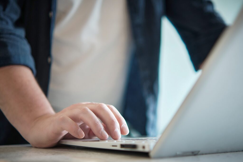 a close up of a digital marketer creating content to boost online sales