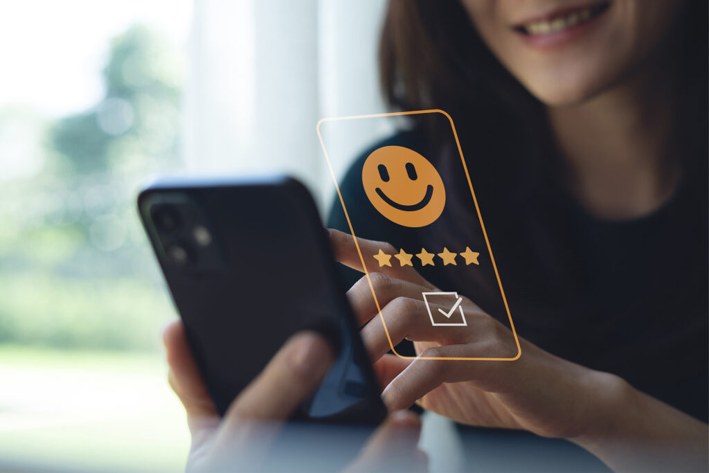 a customer leaving a satisfactory review on their mobile