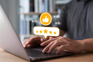 a business owner looking at online reviews as part of a reputation management strategy