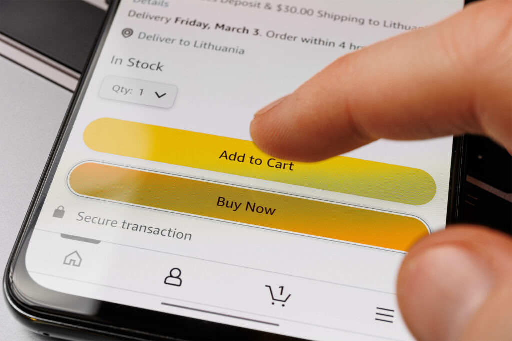 a close up of someone adding an amazon product to the cart on their mobile phone