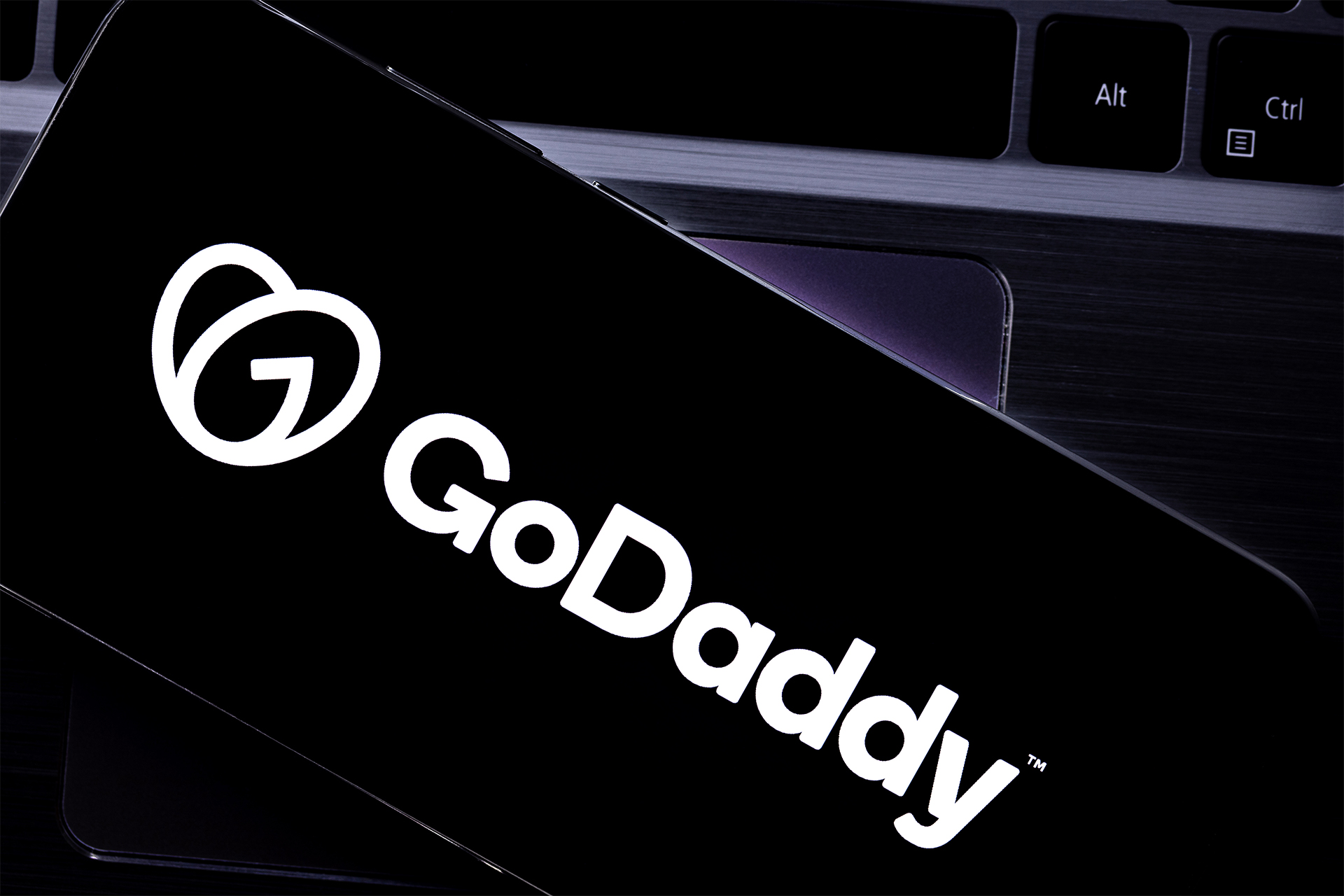 A close up of the GoDaddy logo on a screen