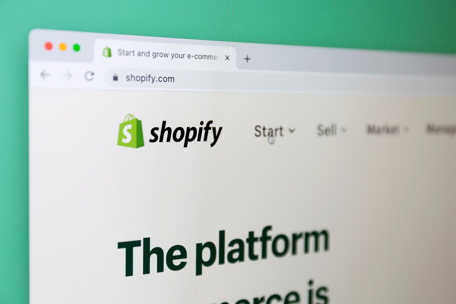 a close up of the Shopify website on a green background