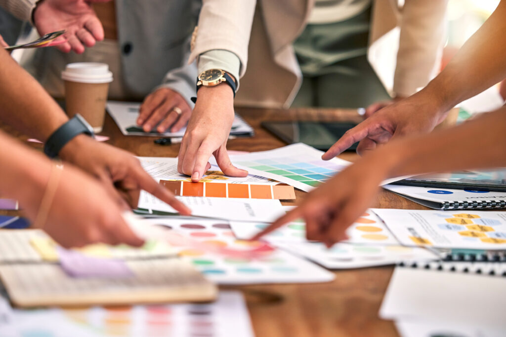 a group of small business branding professionals strategising a visual identity for a client